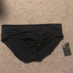 Women’s Nike swimwear bottoms. Brand new with tags and panty liner sticker.